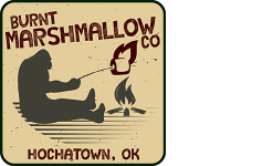 Vintage sign for Burnt Marshmallow Co, showing a person roasting a marshmallow over a campfire in Hochatown, OK
