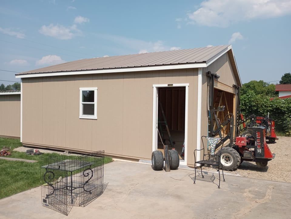 A garage with a forklift parked in front of it
