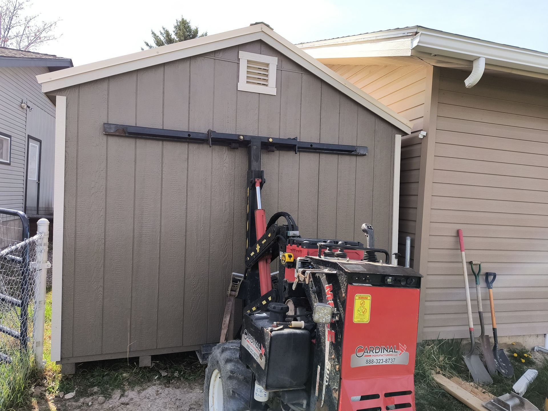 A shed with a wooden floor and a metal roof