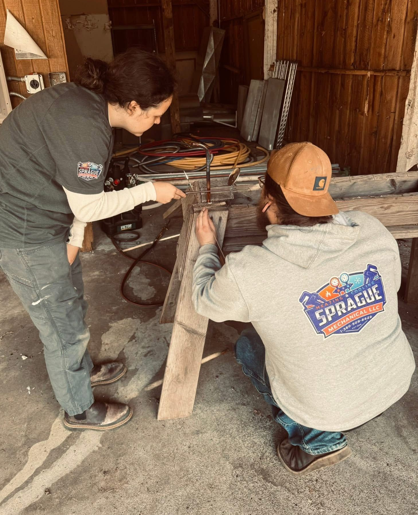 HVAC repair in Belfair WA technicians working on system