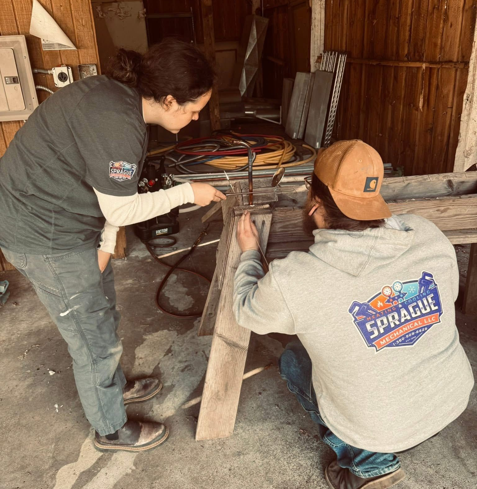 HVAC repair in Belfair WA technicians working on system