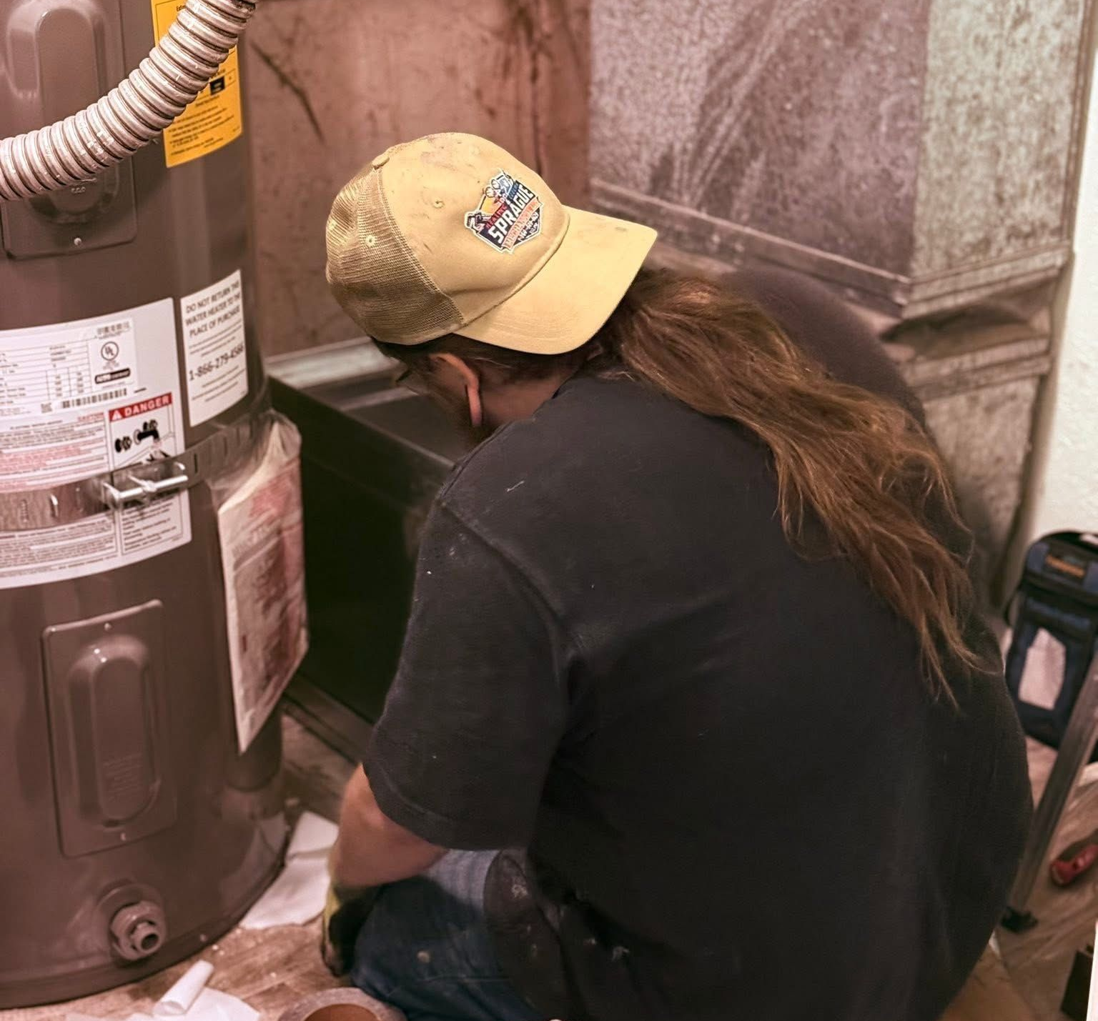 Furnace repair in Belfair WA technician servicing heating system
