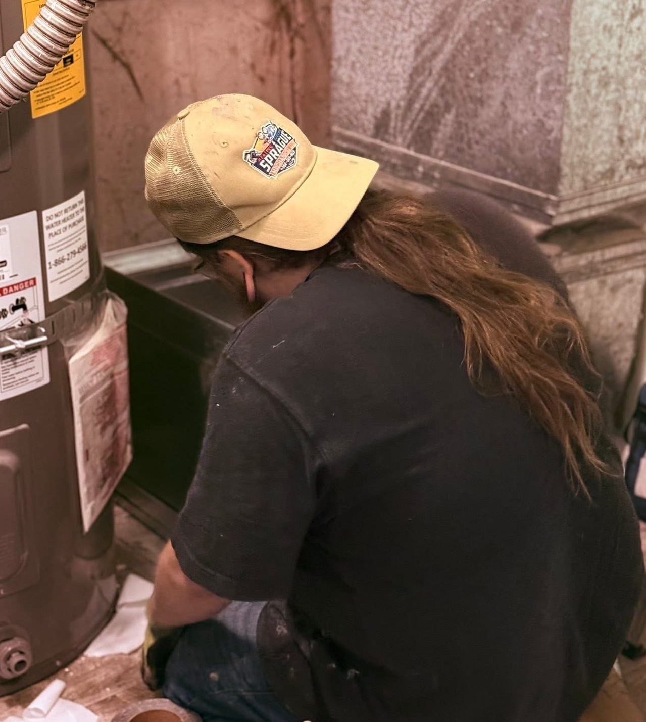 Furnace repair in Belfair WA technician servicing heating system