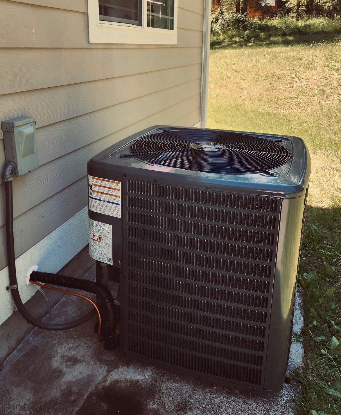 Air conditioning system installation outside a home in Belfair, WA