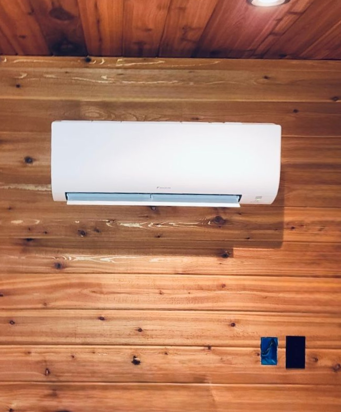 Wall-mounted mini split heat pump installed in a finished interior space