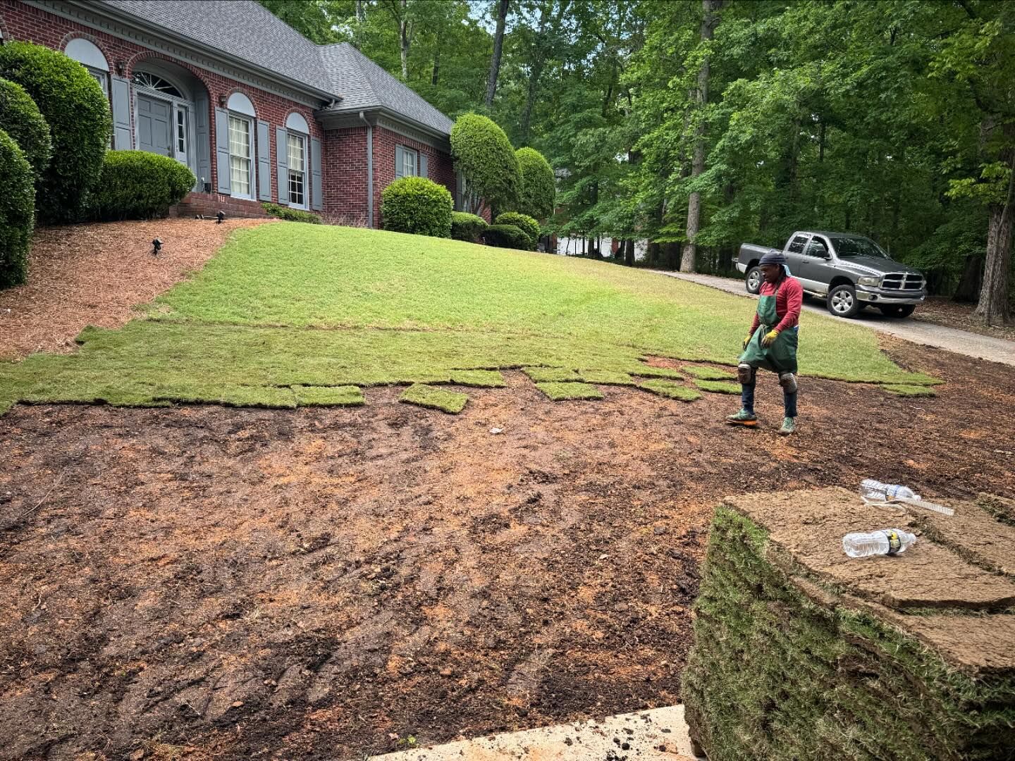 A pile of turf is sitting on top of a wooden pallet.