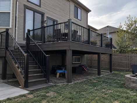 Multi-level composite deck with custom railings