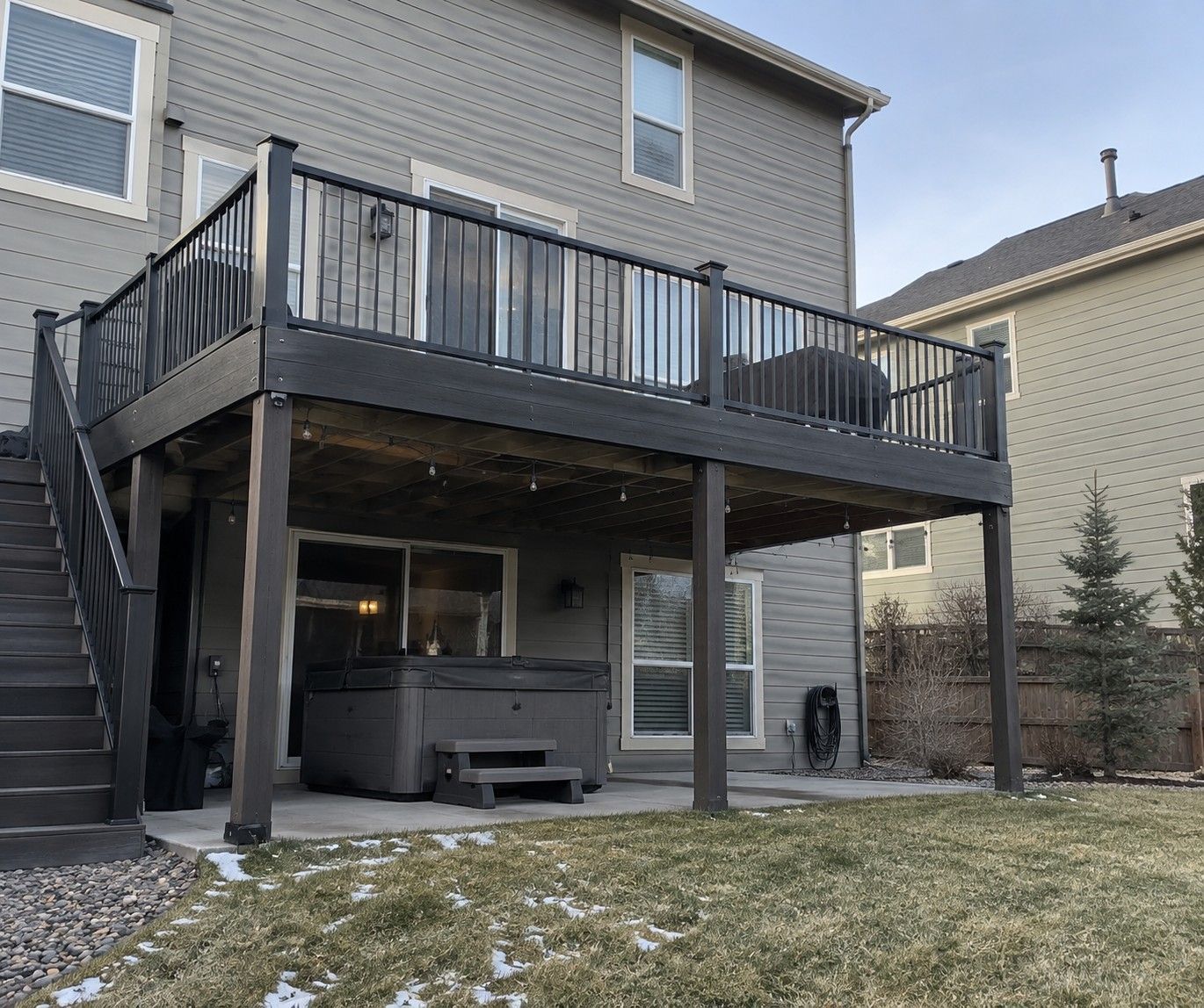 Second-Story Composite Deck with Covered Patio built by Colorado Outdoor Builders in Broomfield, Colorado