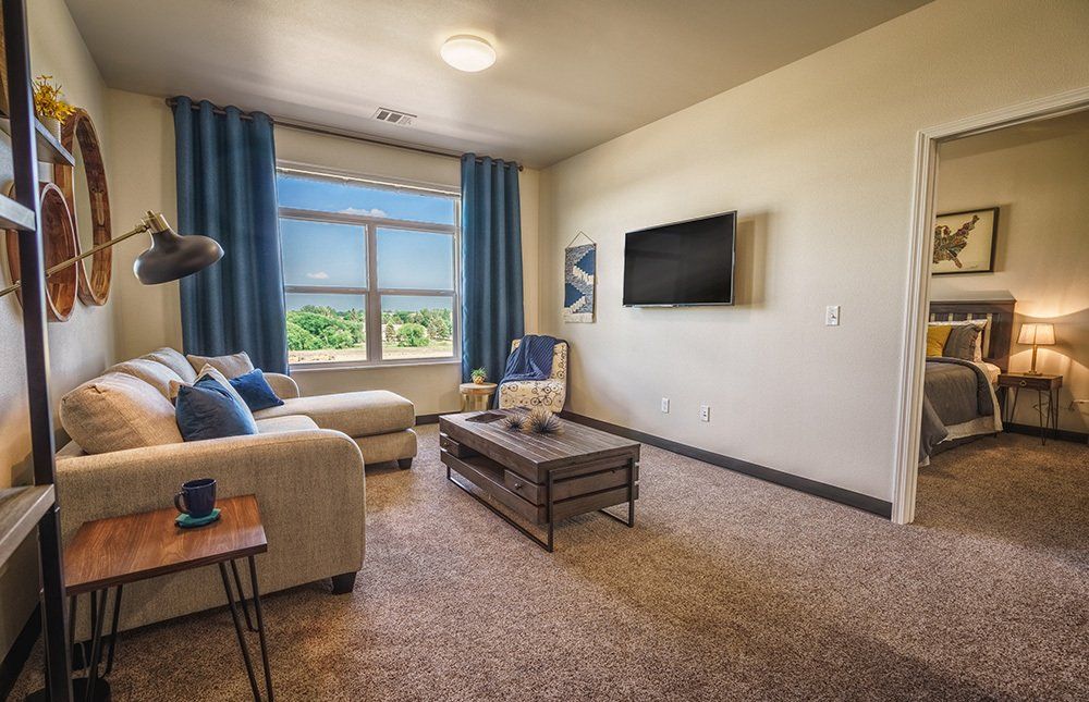 U32 Apartments in Fargo ND Living Room with Mounted TV