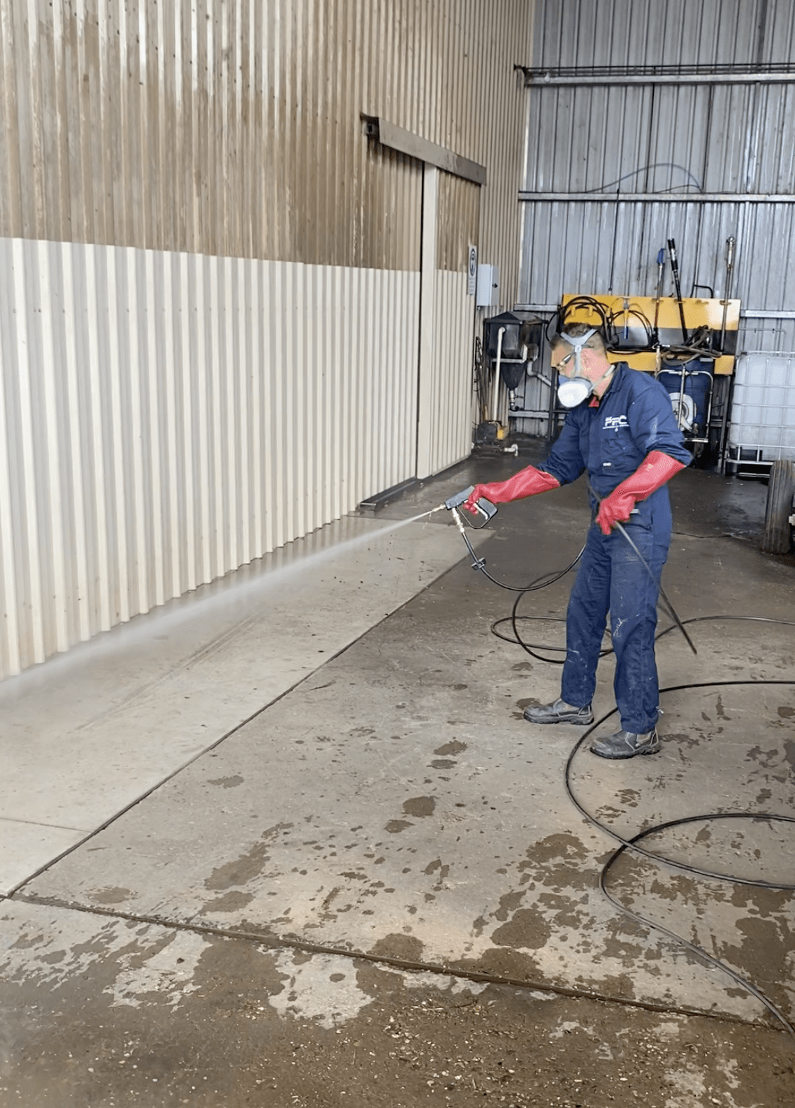 Technician wearing Full PPE While Spraying — Professional Pest Control In Thurgoona NSW
