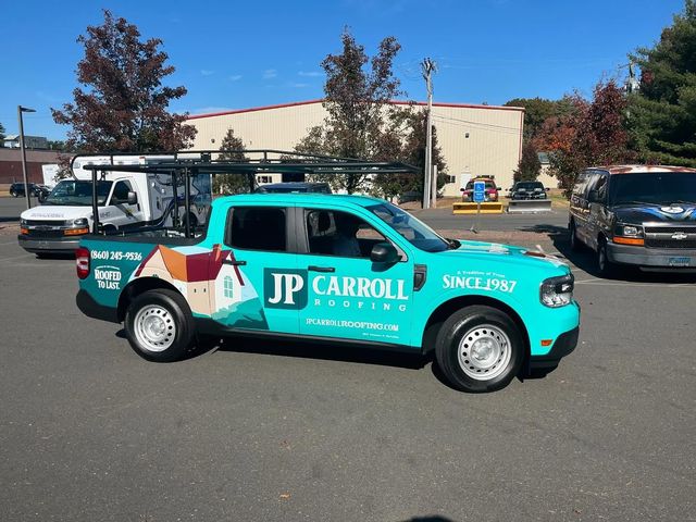 A jp carroll truck is parked in a parking lot