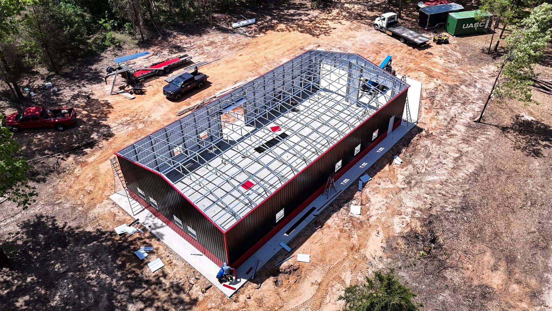 Property owner reviewing a permit document next to a metal cover structure in Florida