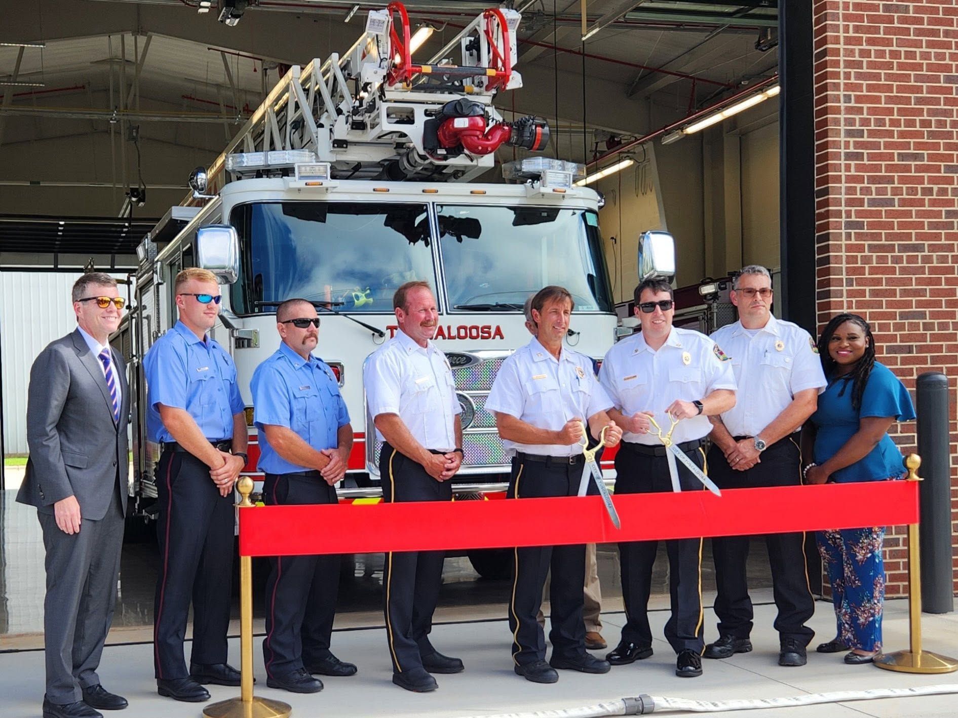 Group cuts red ribbon | Pitts Automotive