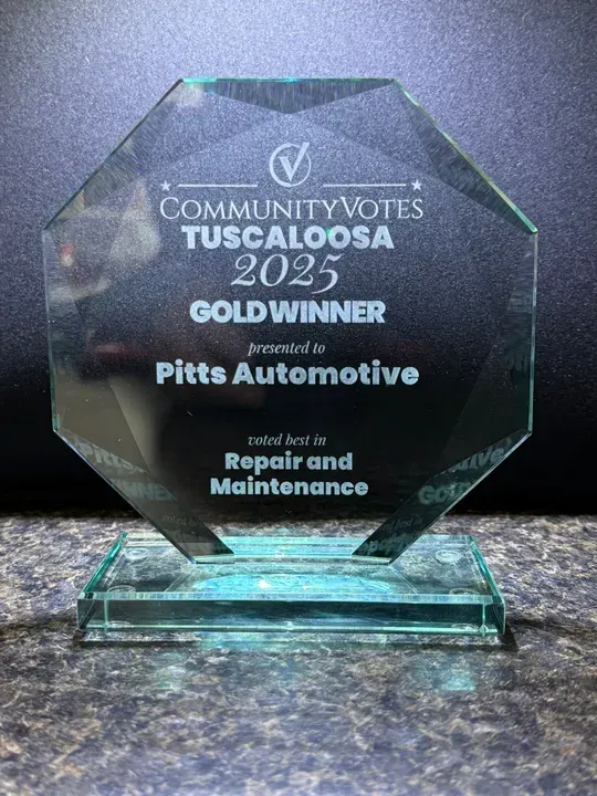 Glass award for “Community Votes 2025” Gold Winner | Pitts Automotive