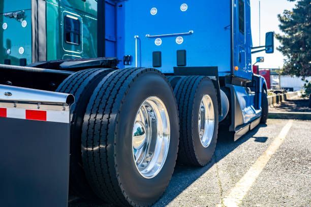 Dual drive tires on a blue semi truck with chrome wheels