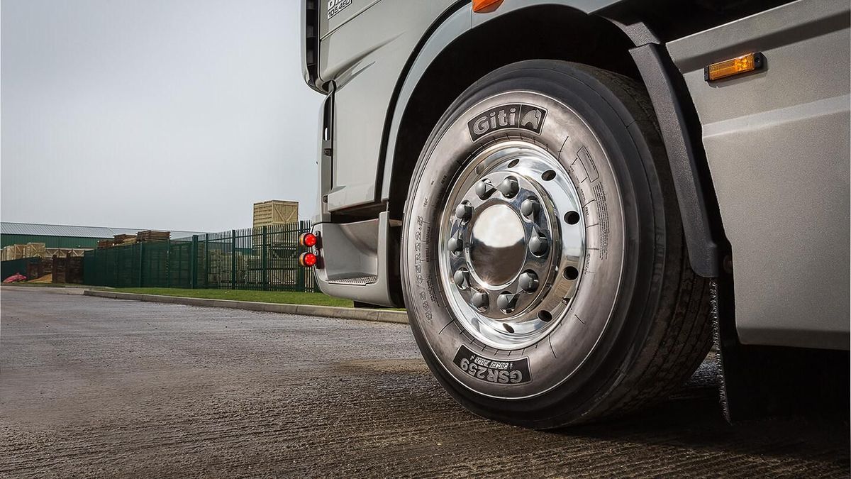 Steer tire on a semi truck with polished aluminum wheel