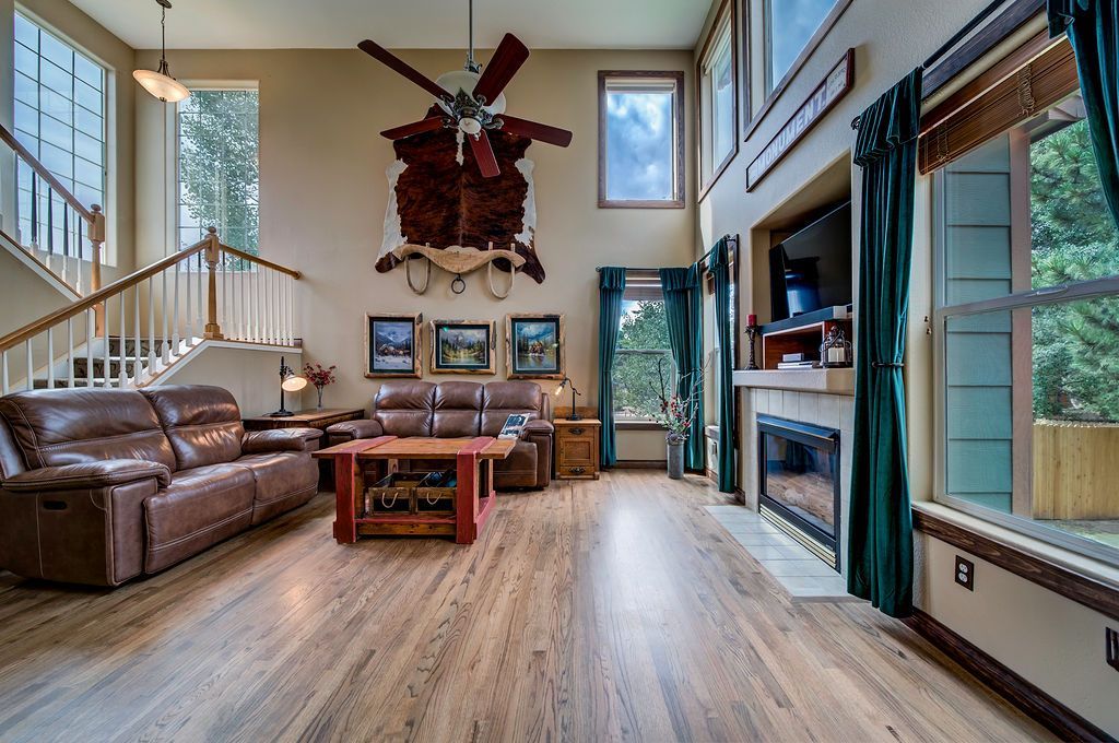 A living room filled with furniture and a fireplace.