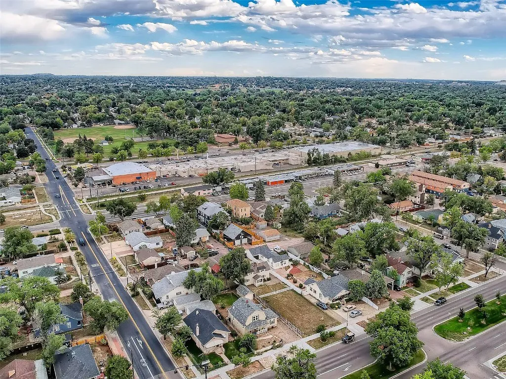 An aerial view of a residential area with lots of trees and houses.