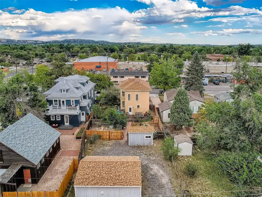 An aerial view of a residential area with a lot of houses and trees.