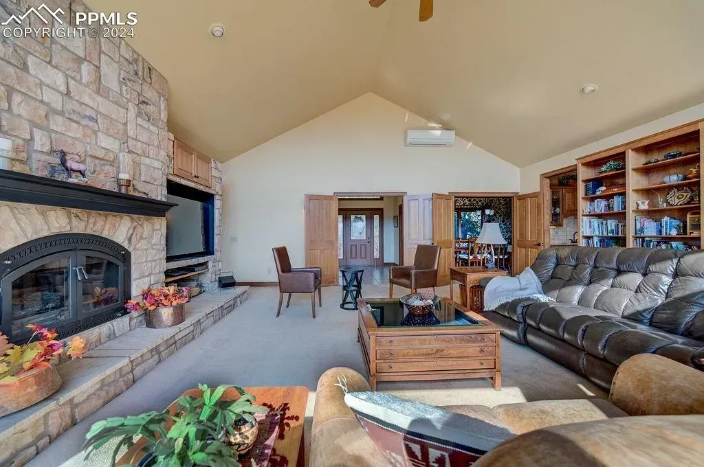 A living room filled with furniture and a fireplace.