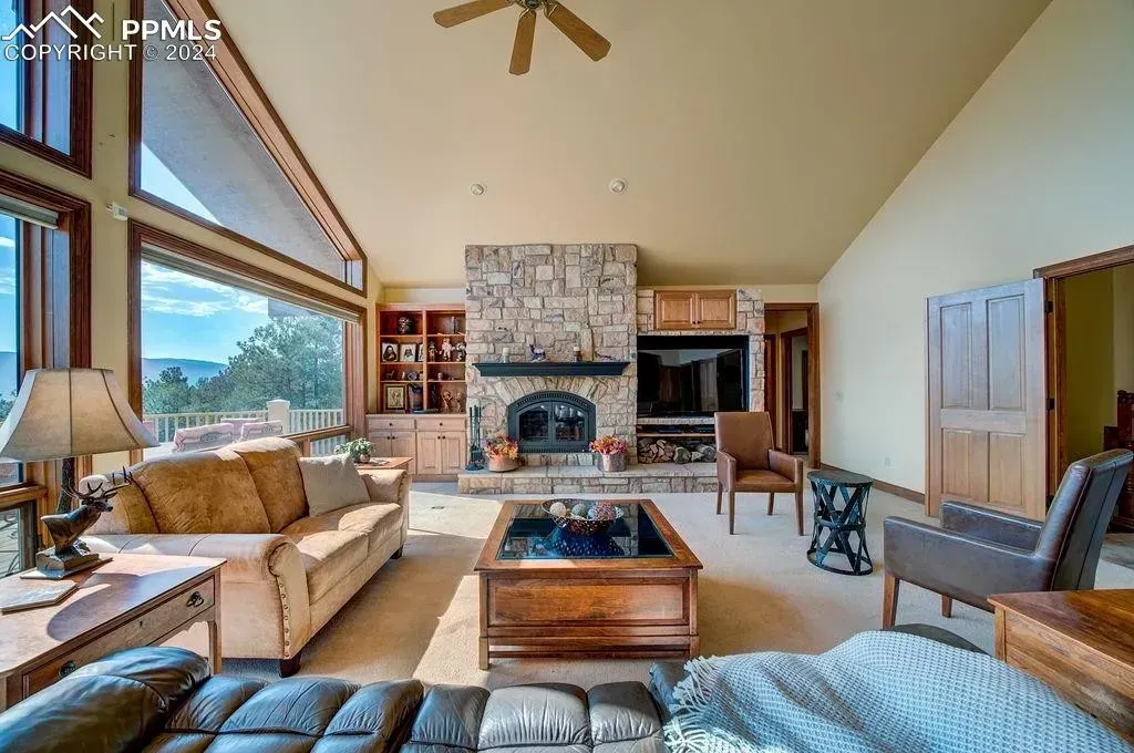 A living room filled with furniture and a fireplace.