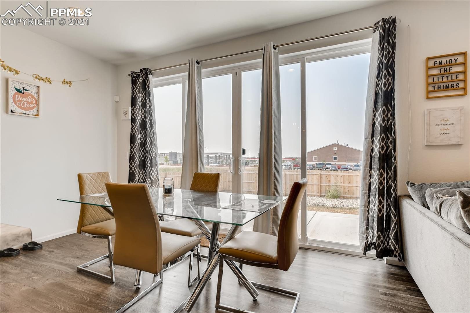 A living room with a dining table and chairs