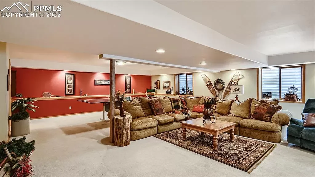 A living room with a lot of furniture and a table