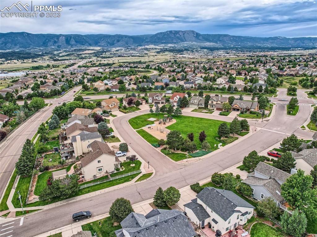 An aerial view of a residential area with lots of houses and trees.