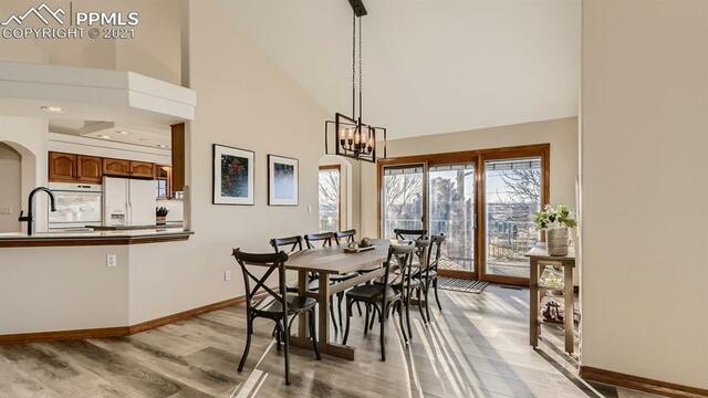 A dining room with a table and chairs in a house.