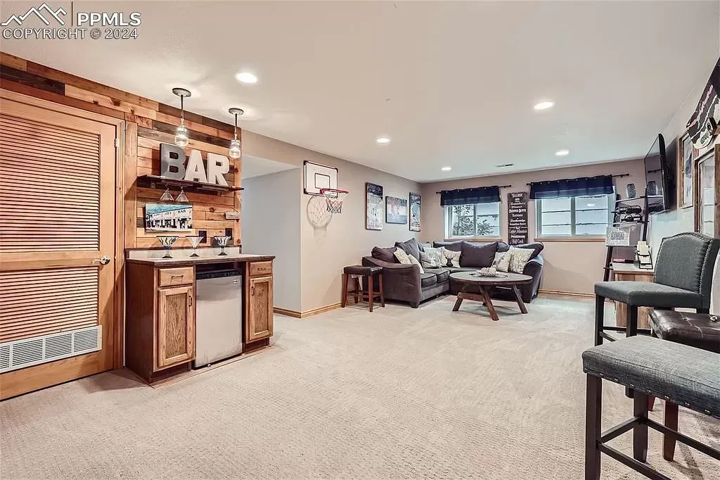 A living room with a bar and a couch.