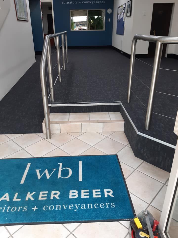 A blue walker beer mat is on the floor