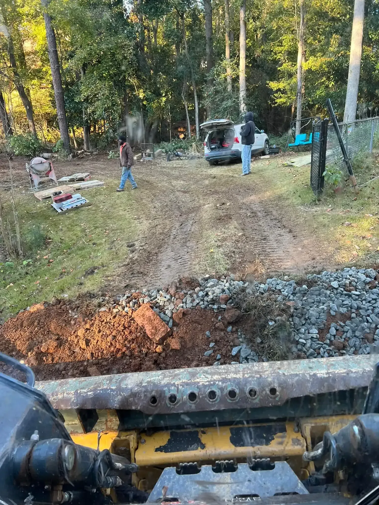 Land clearing crew preparing an overgrown residential property in Columbus, GA Land clearing crew preparing an overgrown residential property in Columbus, GA