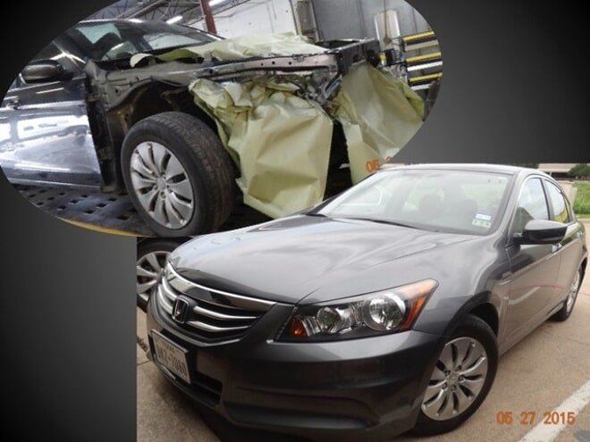 Damaged black sedan with deployed airbag and front-end crash damage