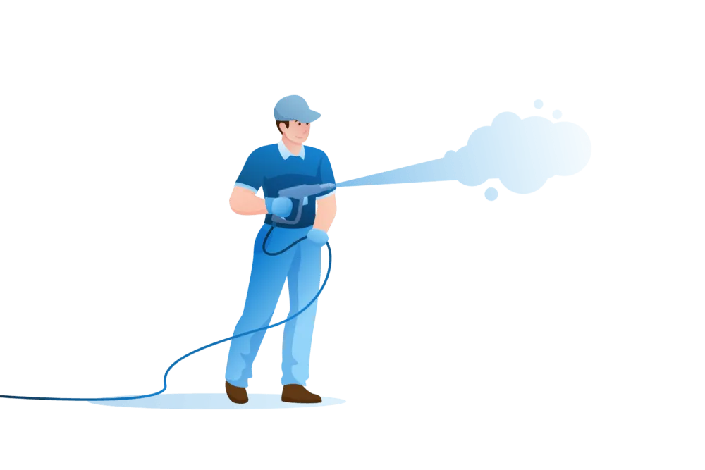 A person in blue work clothes and a cap using a pressure washer to spray a stream of water.