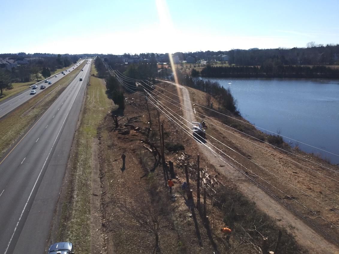 An aerial view of a highway and a lake