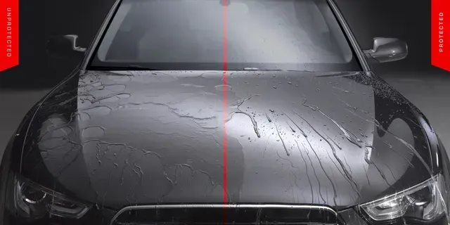 Black car front view with water and raindrops on the hood, lit by red light in a dark studio