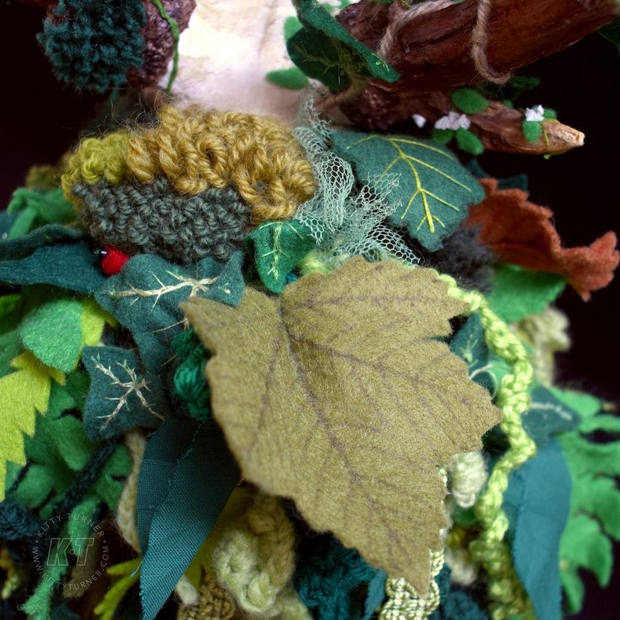 Close up of handmade leaves made from felt, net, crochet and wool. Includes embroidery, crochet, felting and punch needle. 