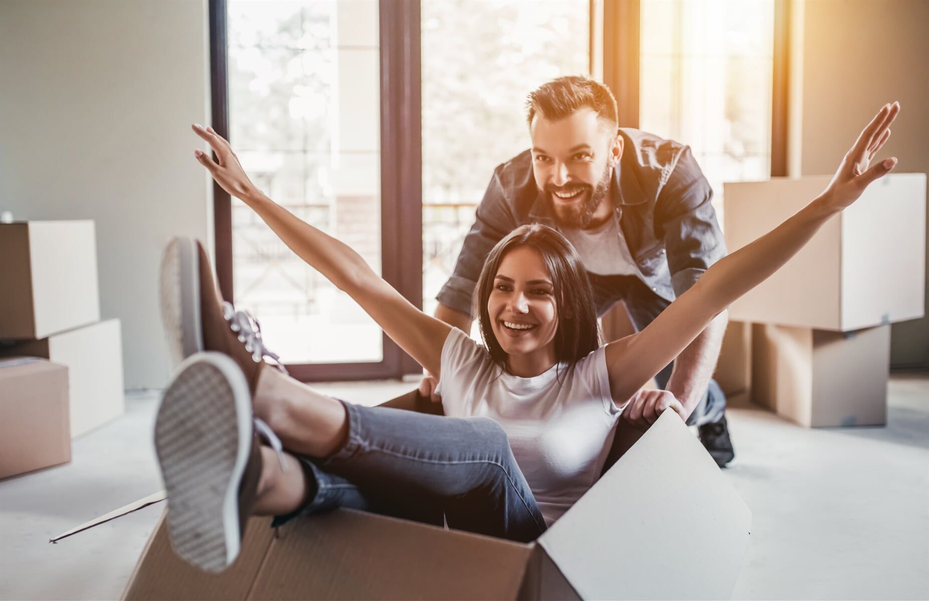 Happy Couple In Their New House — Home Loan Types in Slade Point QLD