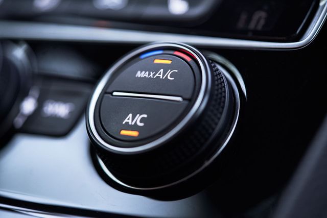 A close up of a car air conditioning control knob.