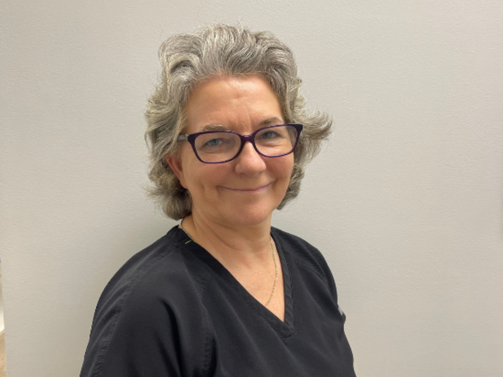 Meet our friendly dental staff in NC | Dr. Walker A woman wearing glasses and a black shirt is smiling for the camera.