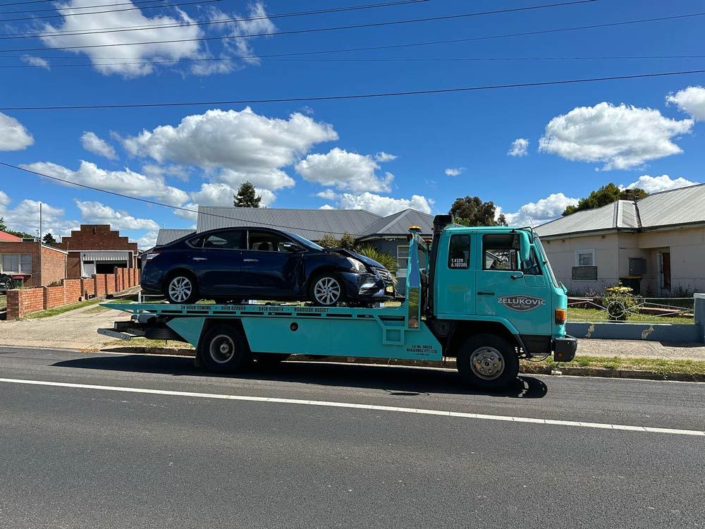 Towing Service in Residential Area — John Zelukovic Smash Repairs in Orange, NSW