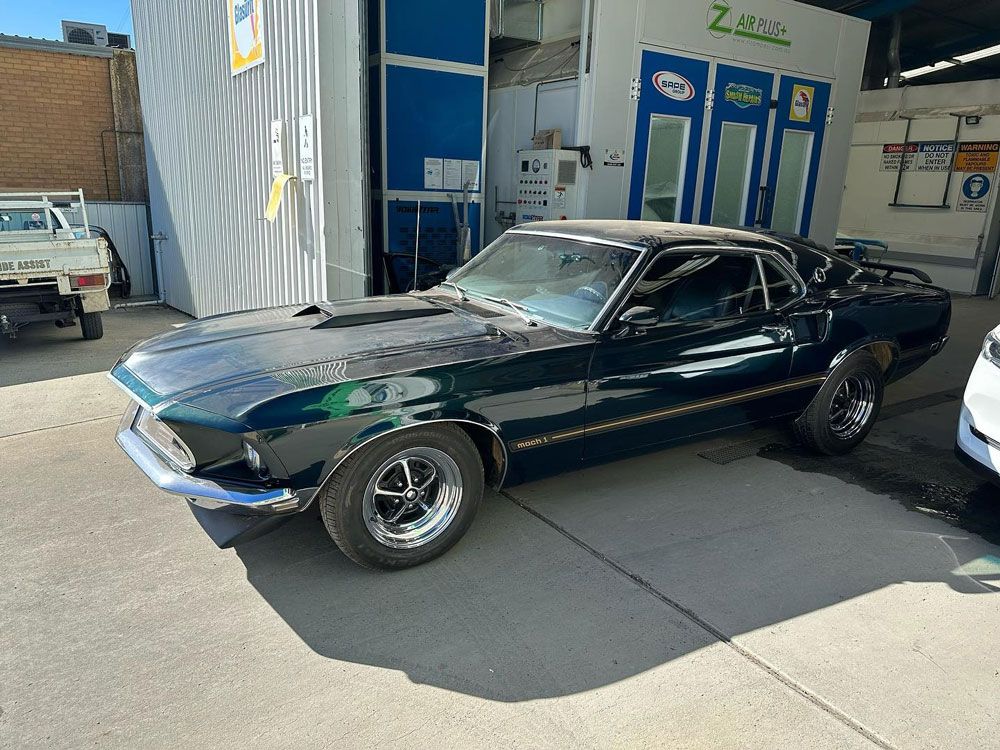 Black Musce Car in Shop — John Zelukovic Smash Repairs in Bathurst, NSW
