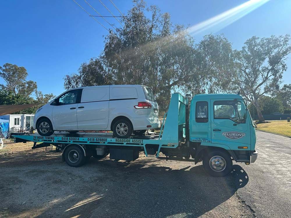 Van Loaded on the Tow Truck — John Zelukovic Smash Repairs in Parkes, NSW