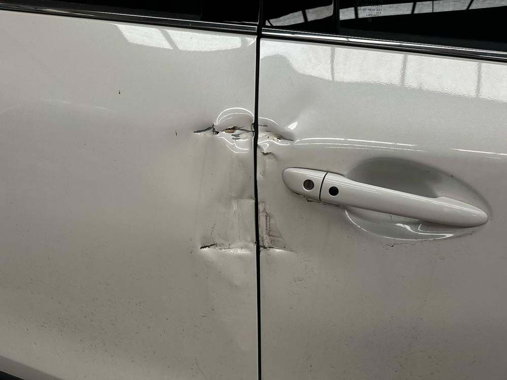 Damage on a Car Door for Repair — John Zelukovic Smash Repairs in Parkes, NSW