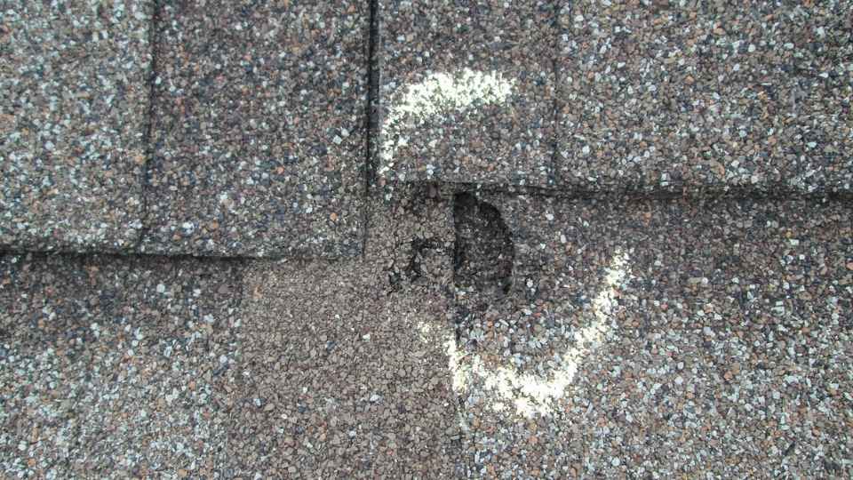roofer repairing roof