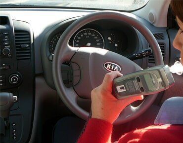 Woman Uses Alcohol Interlock Inside Her Car — Cabba Auto Electrics In Chinderah, NSW
