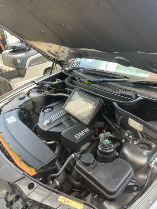 A Diagnostic Tool Place On Top Of The Engine Of A Car— Cabba Auto Electrics In Chinderah, NSW