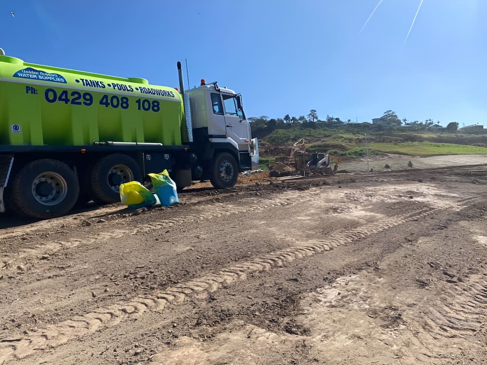 A Green Truck is Parked in a Dirt Field — Jaiden Tanners Water Supplies in Murwillumbah, NSW