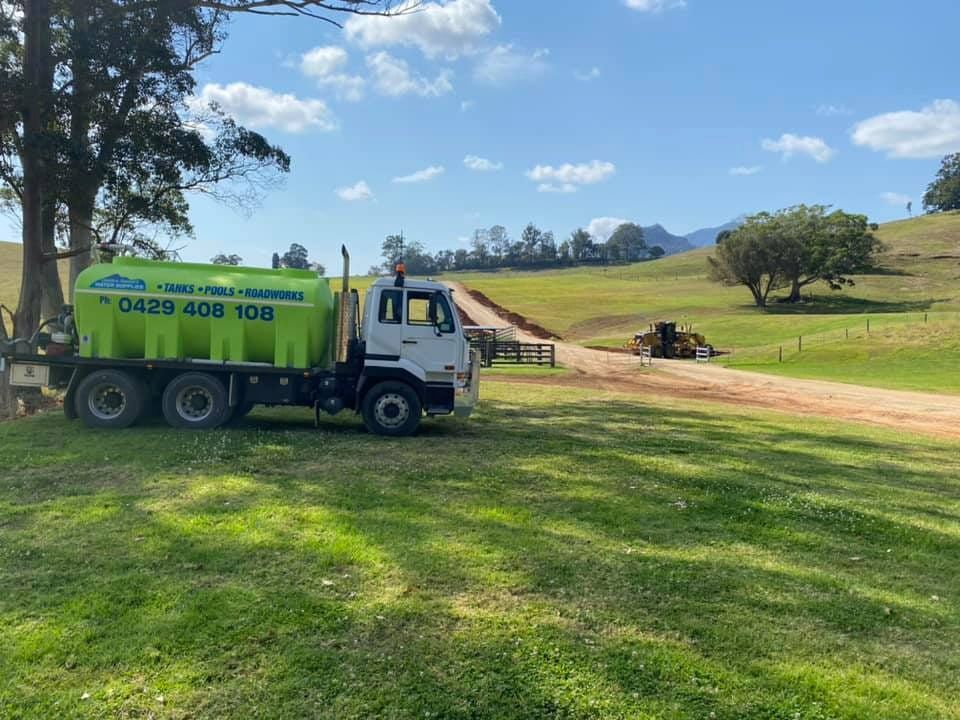 A Group of Construction Workers Are Working on a Road  — Jaiden Tanners Water Supplies in Northern Rivers, NSW