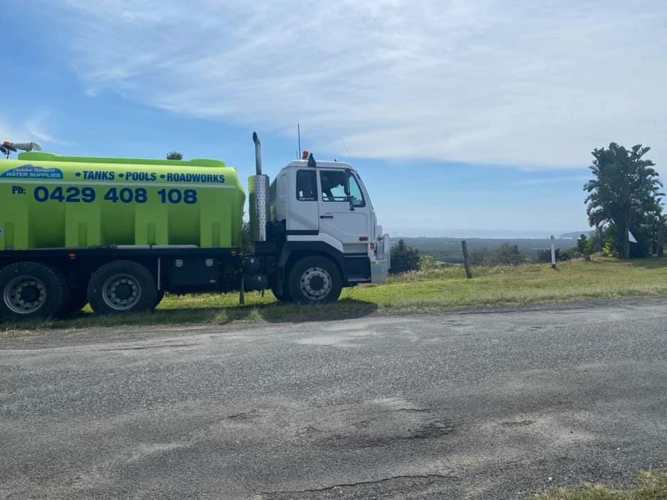 A White Vacuum Truck is Parked on the Side of the Road — Jaiden Tanners Water Supplies in Murwillumbah, NSW